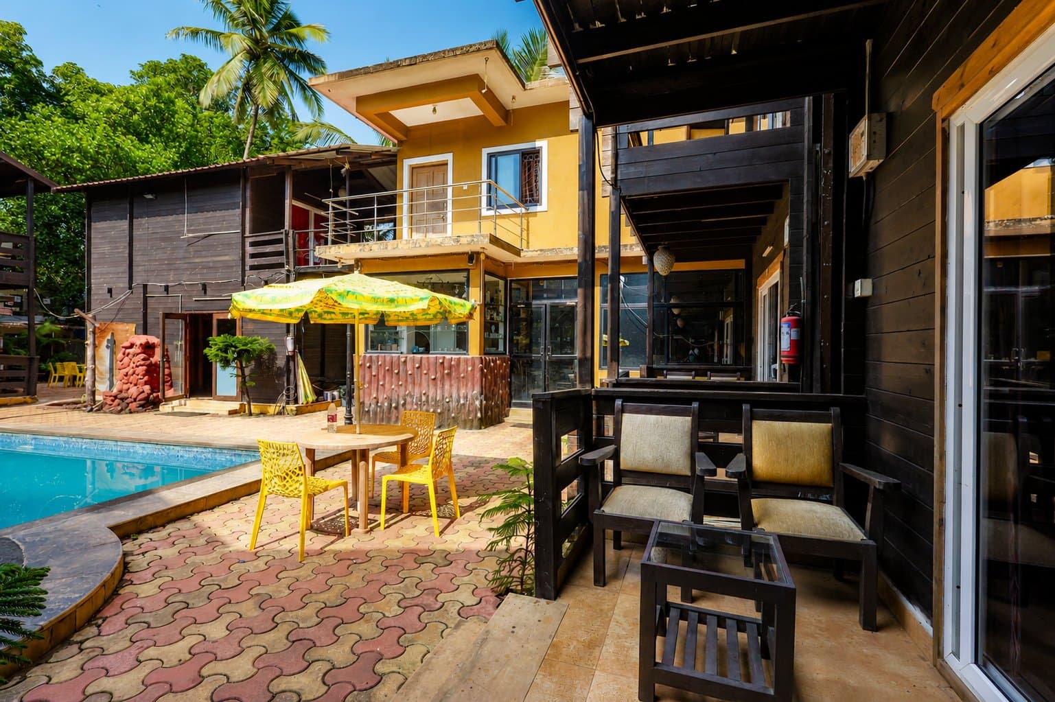 Premium Poolside Cottage — the sit-out beside the pool